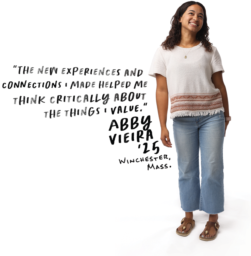 Student standing and smiling with text to her left.