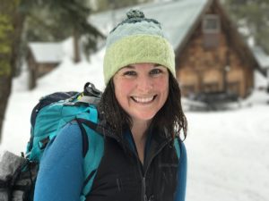 Photo of Emily Halnon outdoors in winter.