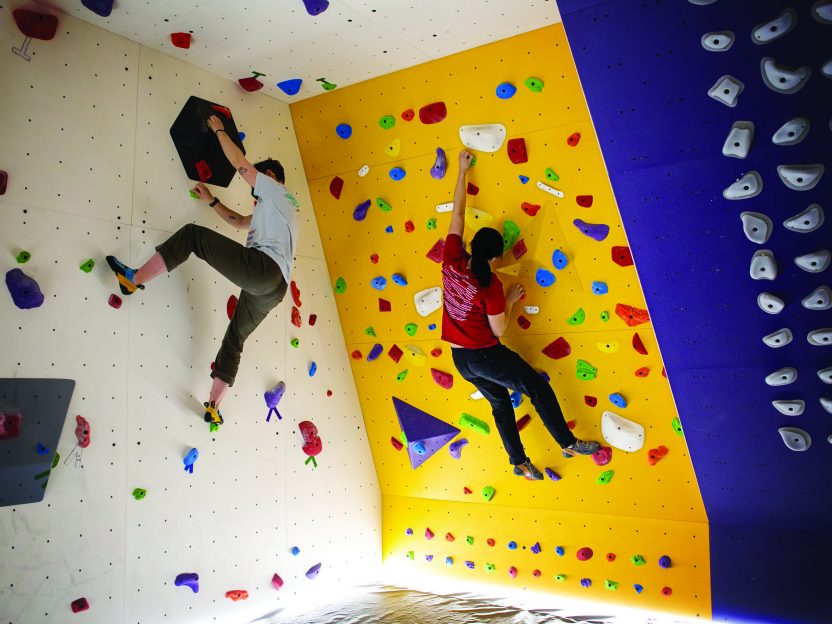 Students climbing the new bouldering cave.