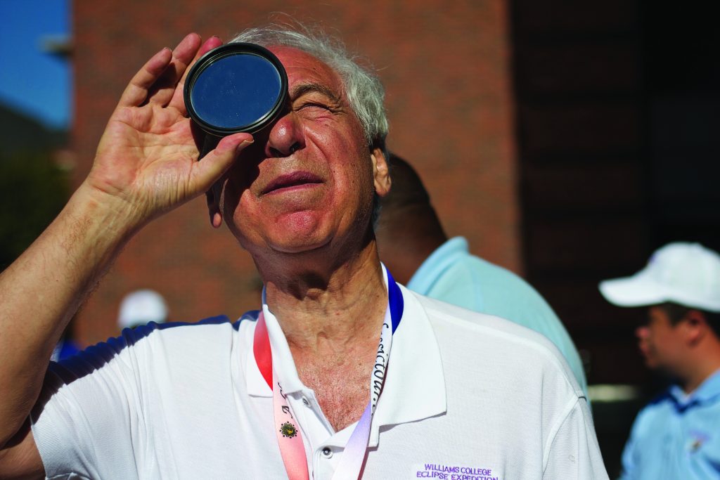 Photo of astronomy professor Jay Pasachoff observing a solar eclipse.