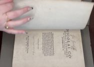 The hand of Darlie Kerns, Class of 2024, has just turned the page of a rare book from Williams College's special collections