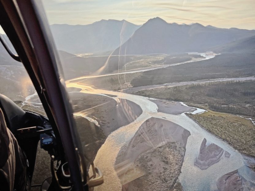 A helicopter-eye view of the Stone Knife River flowing through the Mackenzie Mountains of Canada's Northwest Territories.