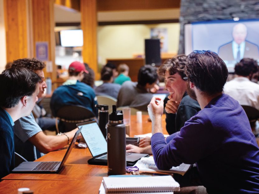 Photo of students gathered in the Paresky Center to vice a televised 2024 presidential debate.