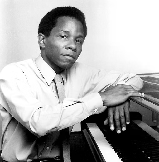 Clyde Criner 2 copy A black and white photo of Clyde Criner at a piano