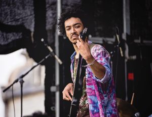 A photo of Diego Mongue playing bass at Spring Fling 2024 on Williams' campus.