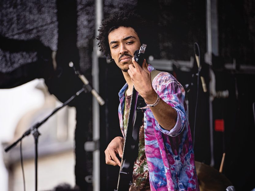 A photo of Diego Mongue playing bass at Spring Fling 2024 on Williams' campus.
