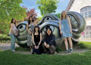 Photo of WCMA summer interns posing in front of a sculpture on campus