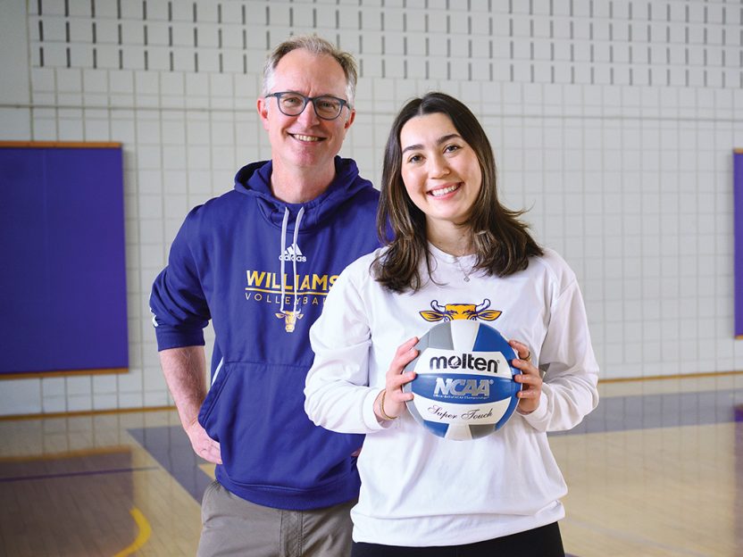 Photo of Professor Noah Sandstrom and Sidra Wohlwend ’25 on the volleyball court at Williams.
