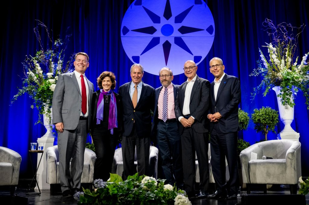 President Mandel, second from left, joins a discussion on the role of higher education today.